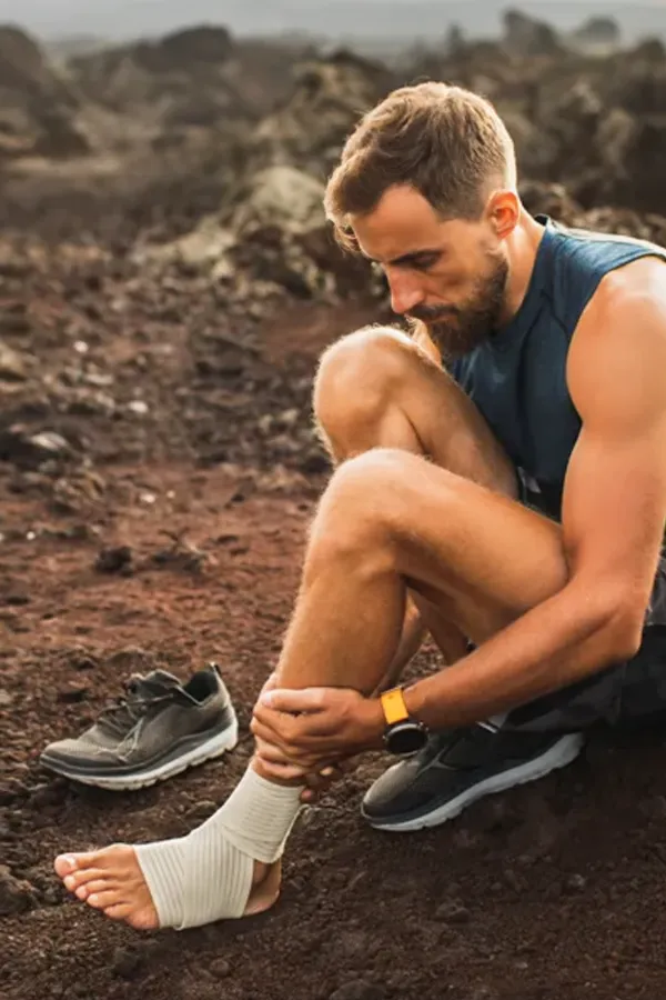 Plantar-Fasciitis-Treatment A man holds his ankle and foot in pain. Get plantar fasciitis treatment from ProCare Wellness Institute in Savannah.