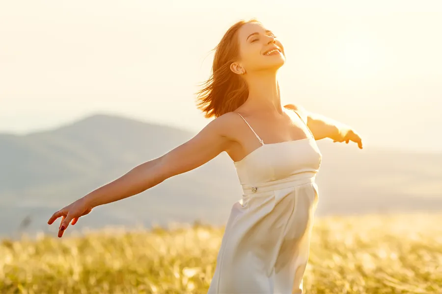 Radiofrequency-Microneedling-for-Arms-Clinic A woman with smooth, taut arms stretches them outside. Schedule Radiofrequency Microneedling for Arm skin from ProCare Wellness Institute in Savannah.