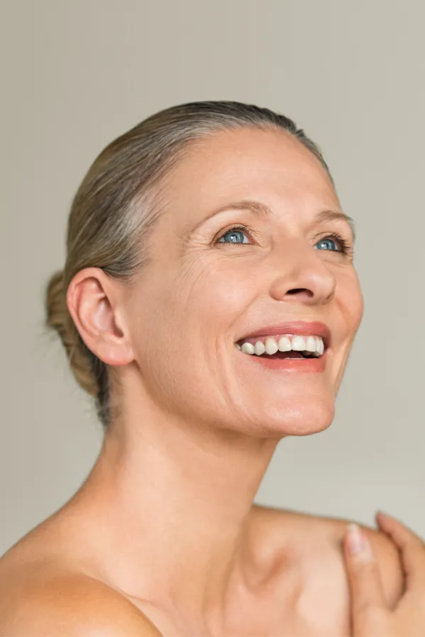 Radiofrequency-Microneedling-for-Neck-Treatment A middle-aged woman with a smooth, trim neck. Get Radiofrequency Microneedling for Neck Skin Treatment from ProCare Wellness Institute in Savannah.