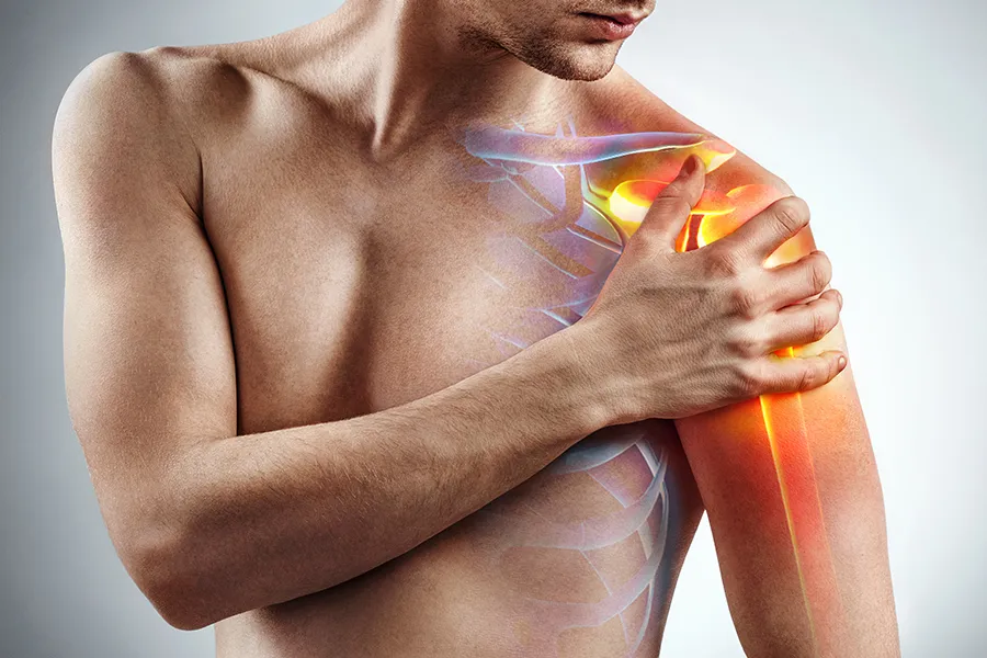 Rotator-Cuff-Clinic A man holds his shoulder; a 3D illustration of the musculo-skeletal shoulder is on the area. Get rotator cuff treatment from ProCare Wellness Institute in Savannah.